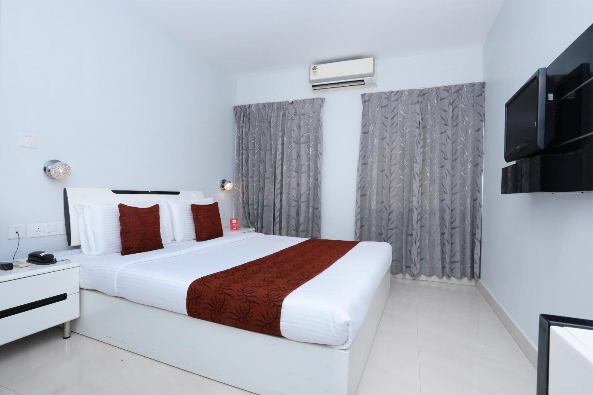 Super Townhouse Malabar Illam Hotel